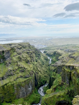 Watching down the beautiful Múlagljúfur canyon in Iceland with moss covered mountain sides
