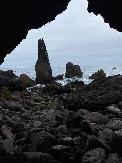 Small sea stack by Reykjanes Lighthouse seen from inside of a cave