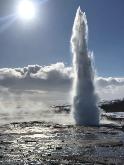 Geysir in Iceland throwing the hot water many meters in the air