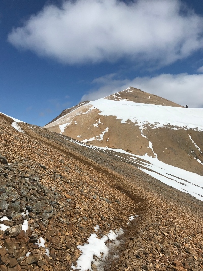 Getting close to the partly snow covered Móskarðshnjúkar rhyolite summit