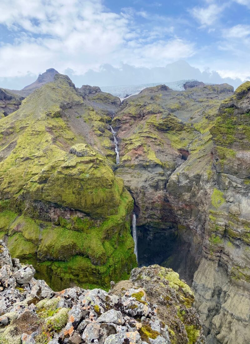 Moss covered mountain tops and a small waterfall in Múlagljúfur Canyon in Iceland