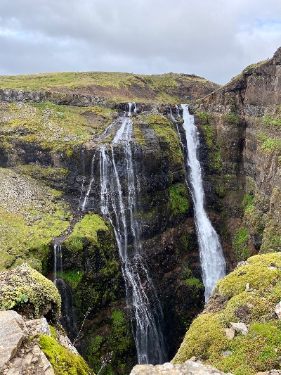 The view of Glymur Waterfall in summer