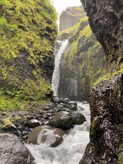 A waterfall in the end of a narrow gorge in Iceland