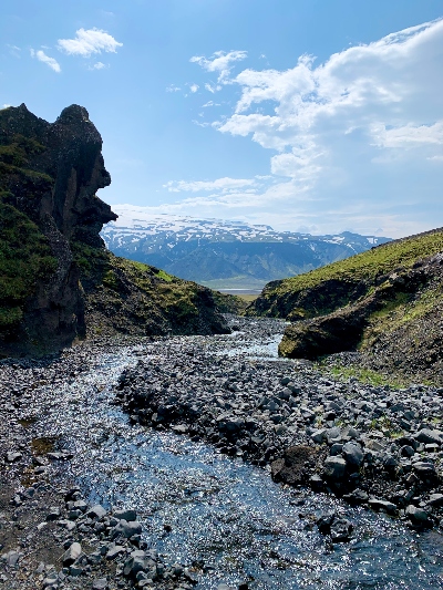 A small creek and mountain view in sunny weather in Iceland