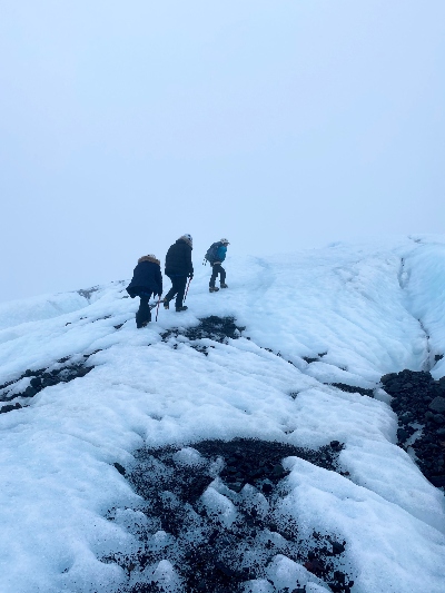 Three hikers on a glacier hike in Iceland