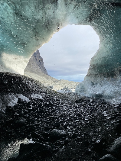 Watching the mountains from the inside of an ice cave
