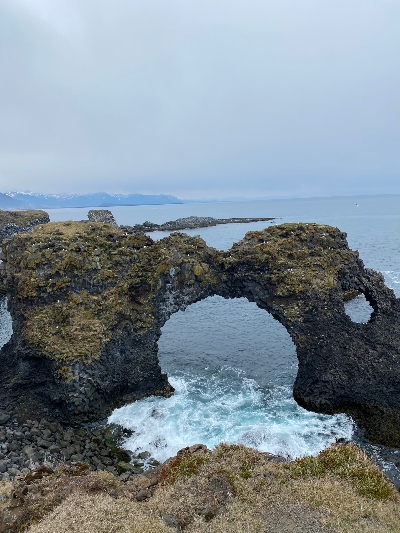 Stone arch by the shore at Arnarstapi Snæfellsnes peninsula