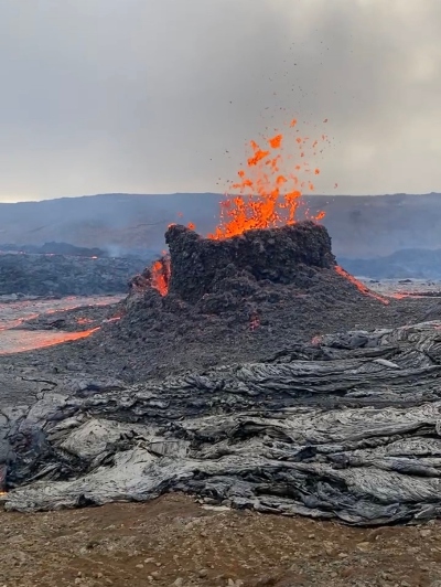 A small volcanic crater throwing magma to the air