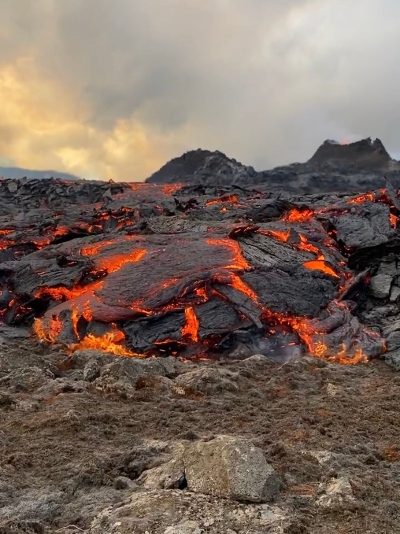 Slowly flowing lava up close. Black and orange coloured