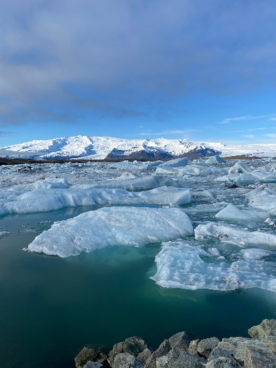 Icebergs floating on a turquoise colored Jökulsárlón Glacier Lagoon in Iceland