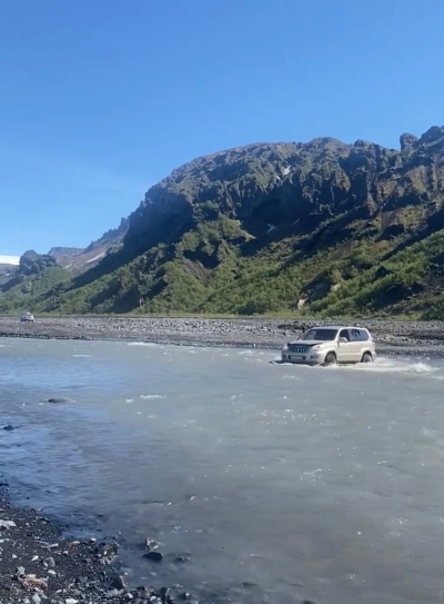A jeep crossing Krossá River in Þórsmörk Iceland