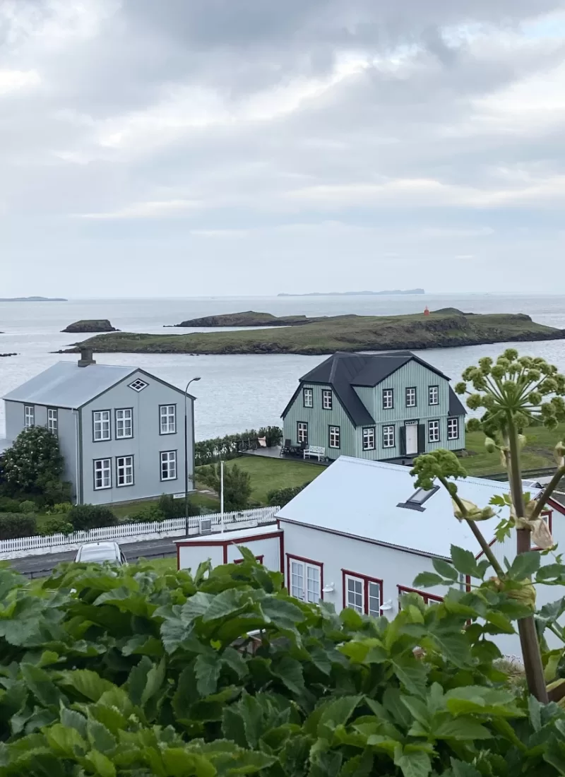 Three old renovated and charming houses in Stykkishólmur Iceland with the ocean in the back ground