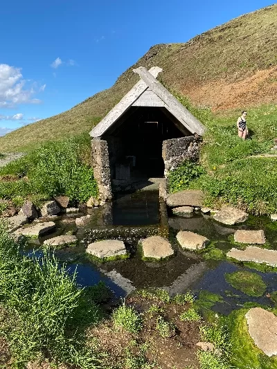 A small shed right next to Hrunalaug hot spring in Iceland