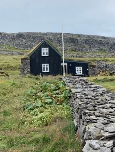 An old black house in the Westfjords in Iceland called Litlibær