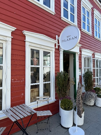 A red old timber house with white windows in the town center in Selfoss Iceland.